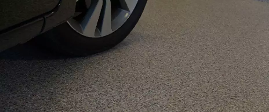 Car parked on epoxy garage floor