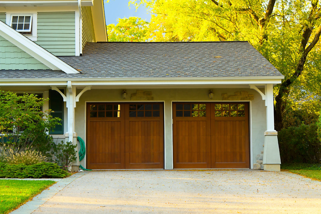 two-car garage with wooden doors
