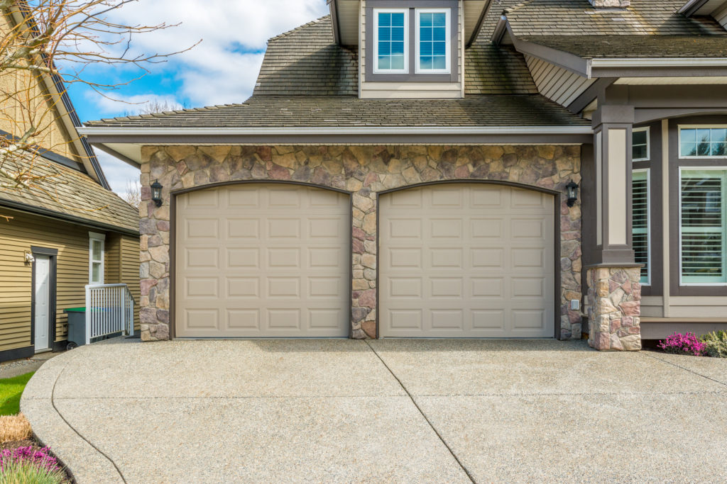 two car garage attached to large house