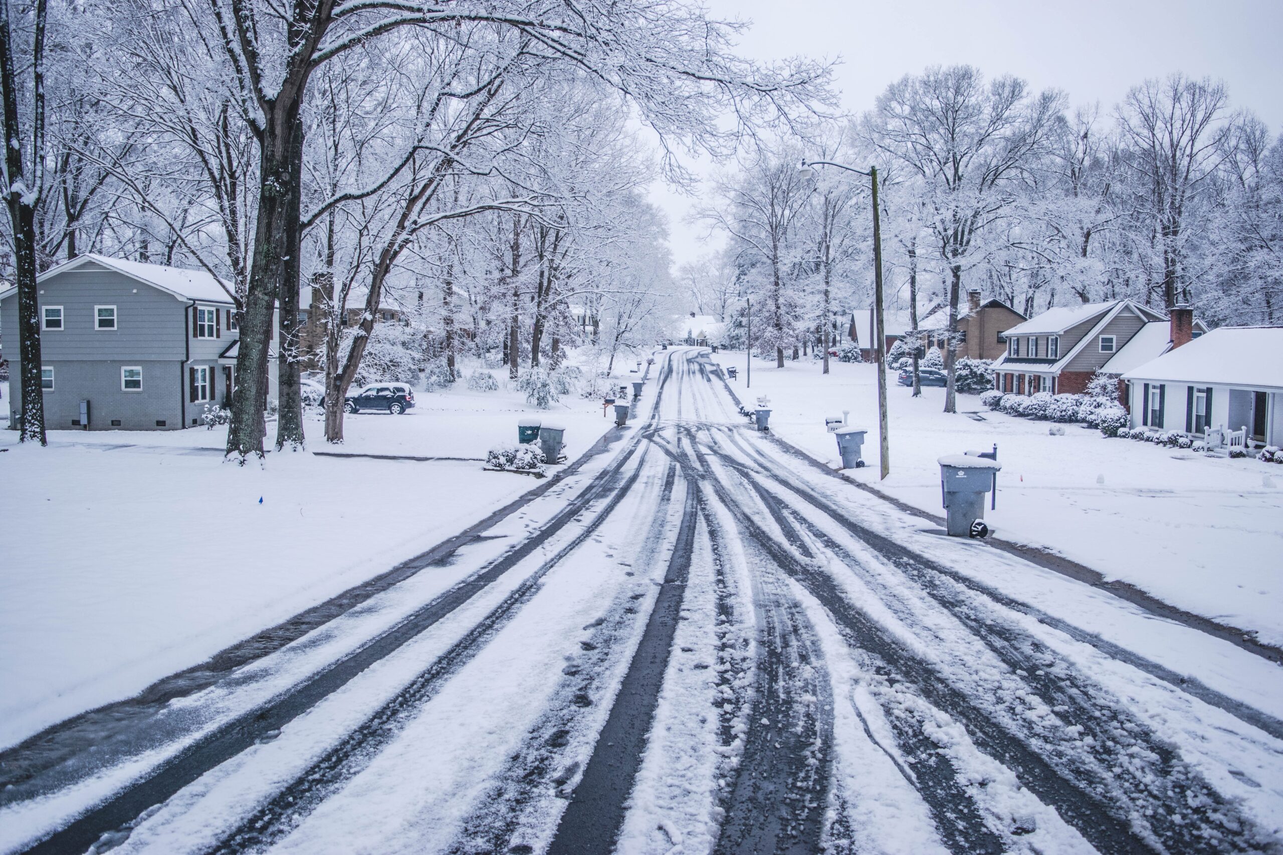 A snowy neighborhood road